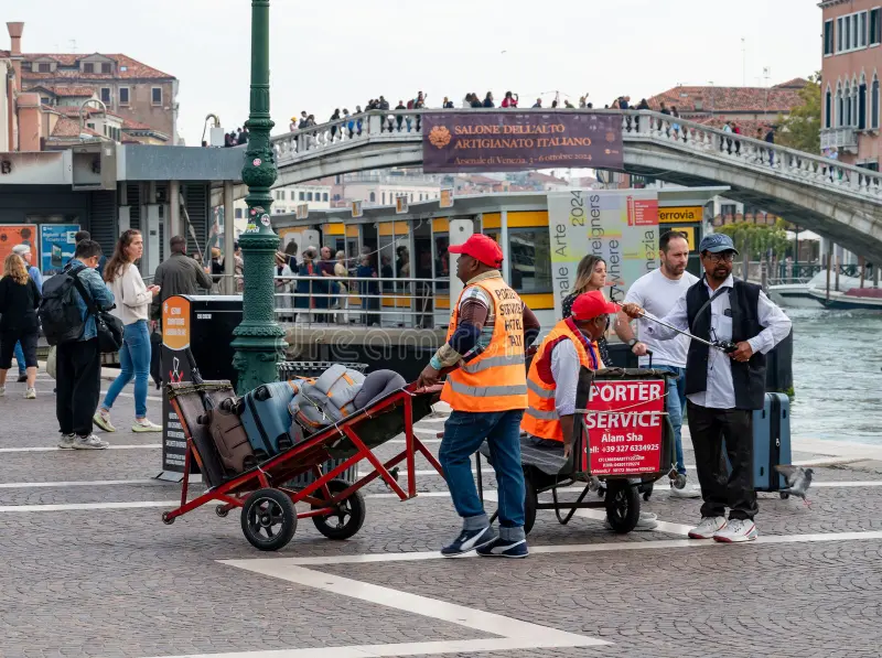venice-italy-september-porters-carts-near-santa-lucia-train-station-high-quality-photo-352751361